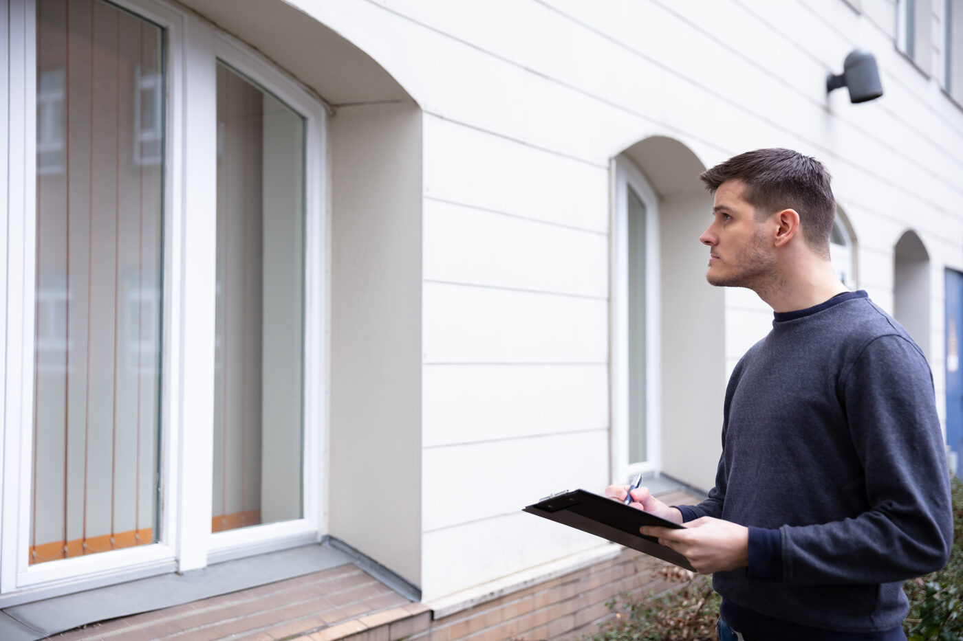 An inspector reviewing a multi-family property.